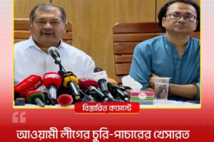 Two men sit at a press conference with many microphones in front of them on the table